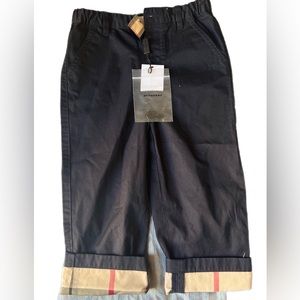 Burberry black Ricky' chino trousers with iconic Burberry check cuffs